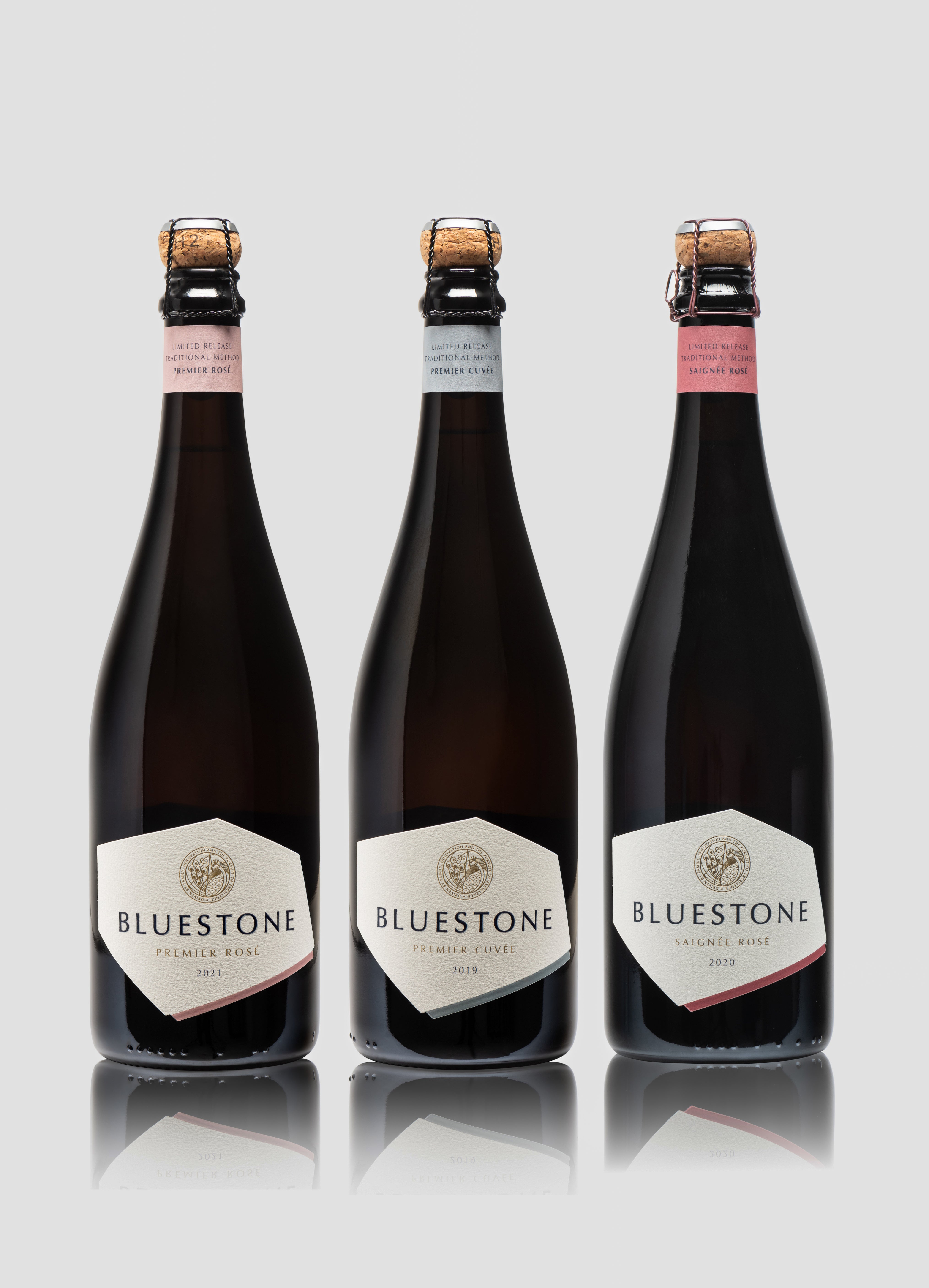 Picture shows three bottles of Bluestone sparkling wine; Premier Rosé, Premier Cuvée and Saignée Rosé (L-R).